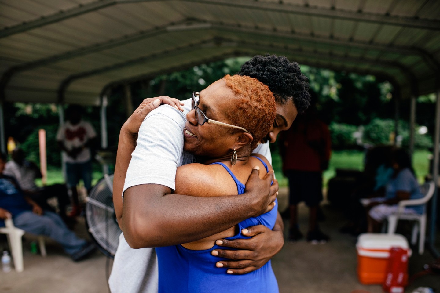 Man hugging, comforting woman