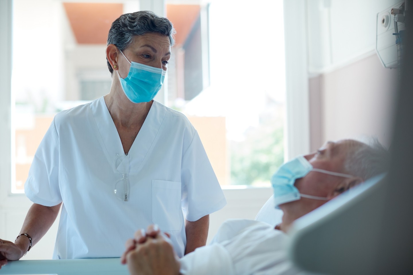 nurse attending to patient