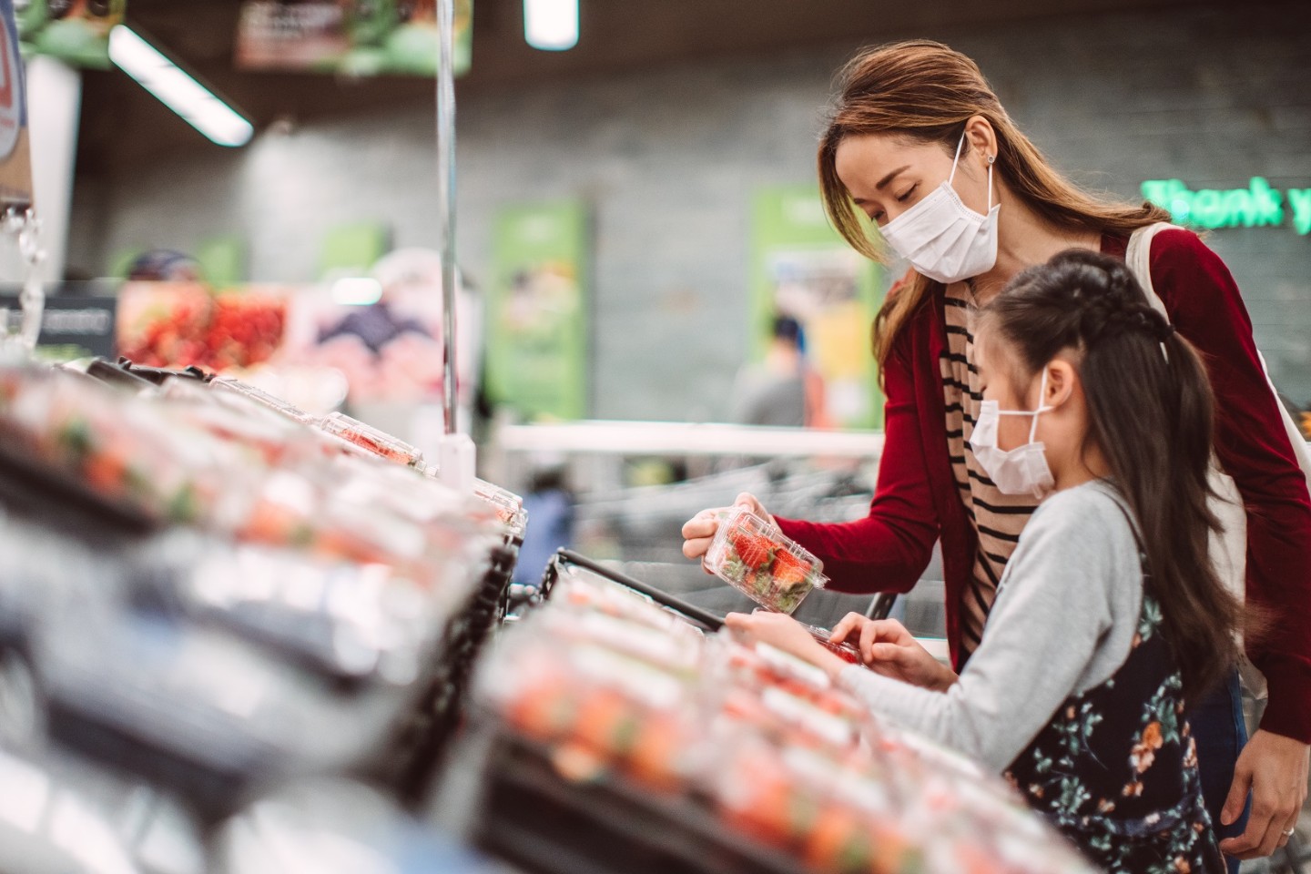 Mother and daughter food shopping