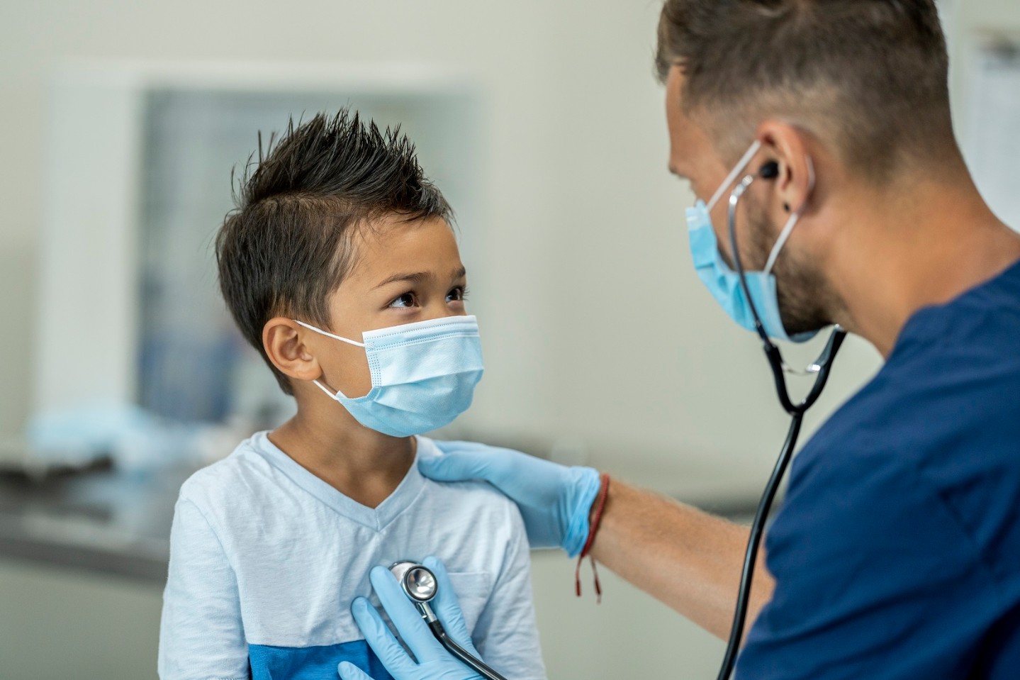 Doctor examining boy