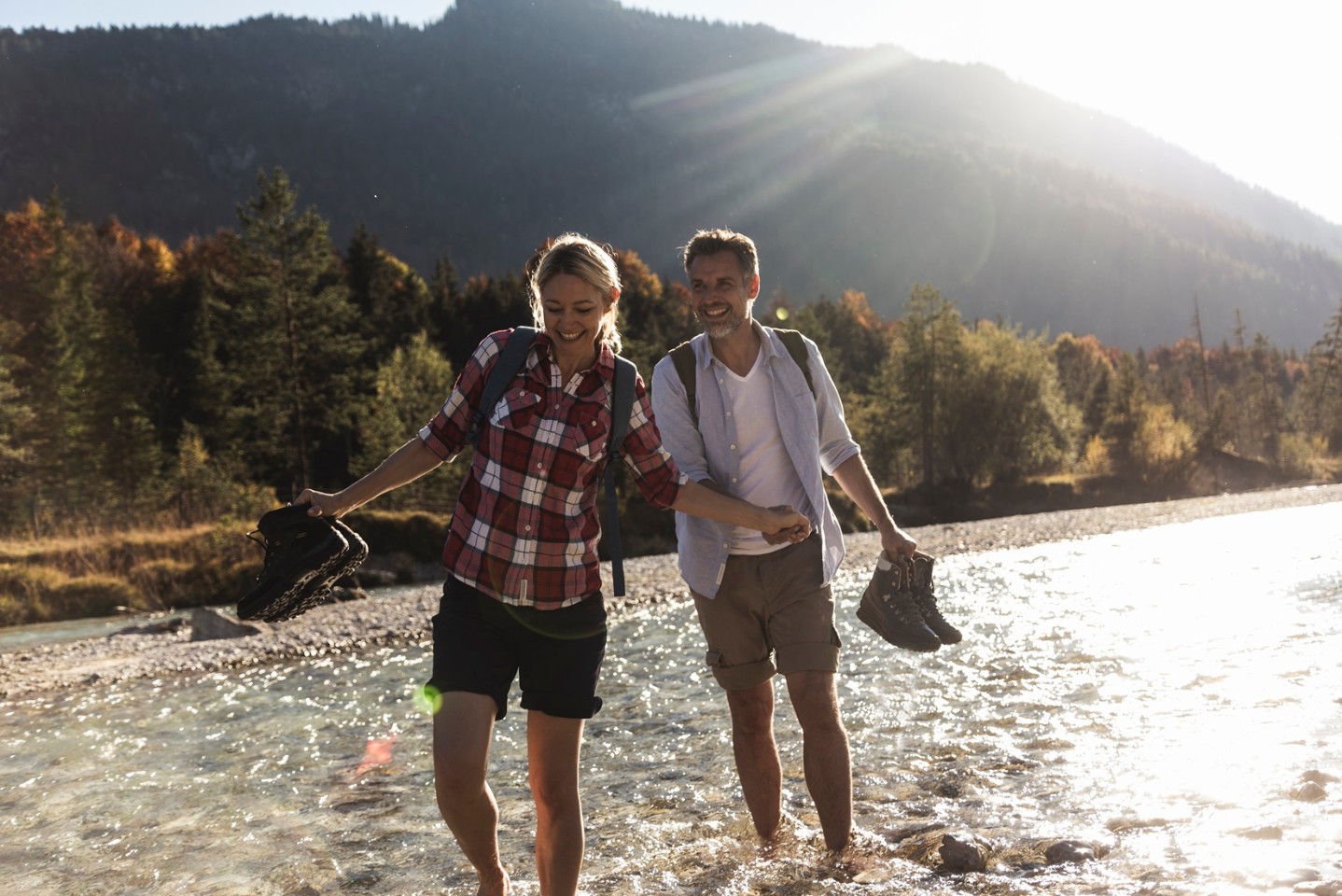 Couple wading in a river